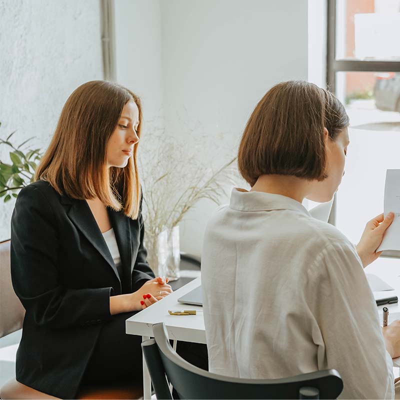 Women-working-together-in-healthcare-organization-looking-at-graphs